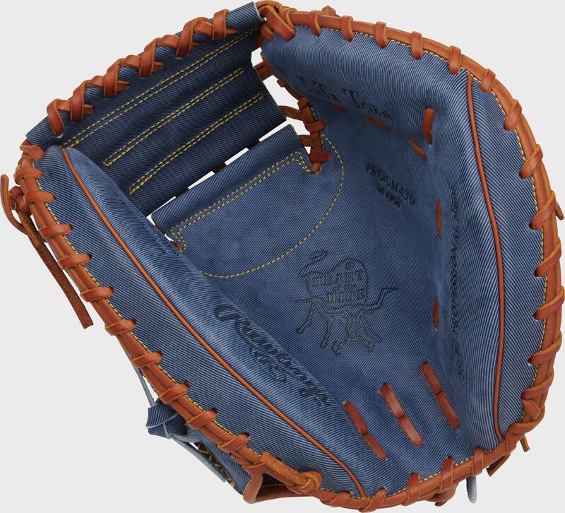 Palm of a Rawlings Heart of the Hide Pro Label Denim catcher's mitt with tan laces loading=