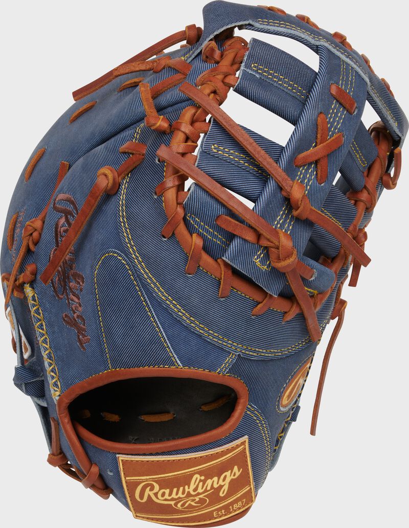Back of a Heart of the Hide Pro Label Denim 1st base mitt with a tan leather Rawlings patch loading=