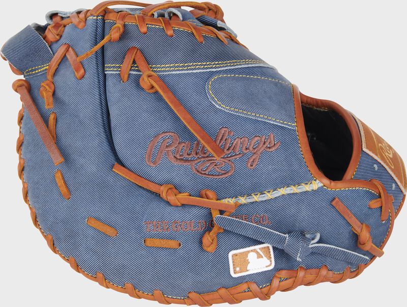 Back of a Heart of the Hide Pro Label Denim 1st base mitt with the MLB logo on the pinky loading=