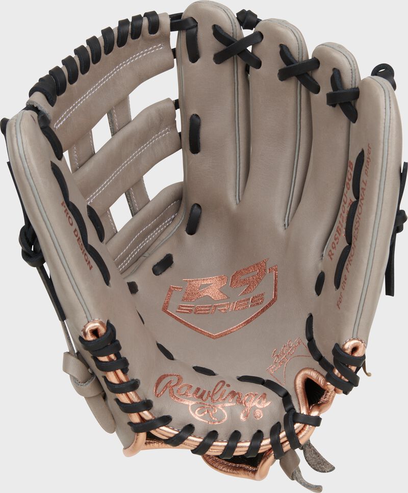 Gray palm of a Rawlings R9 Series fastpitch glove with rose gold stamping and black laces loading=