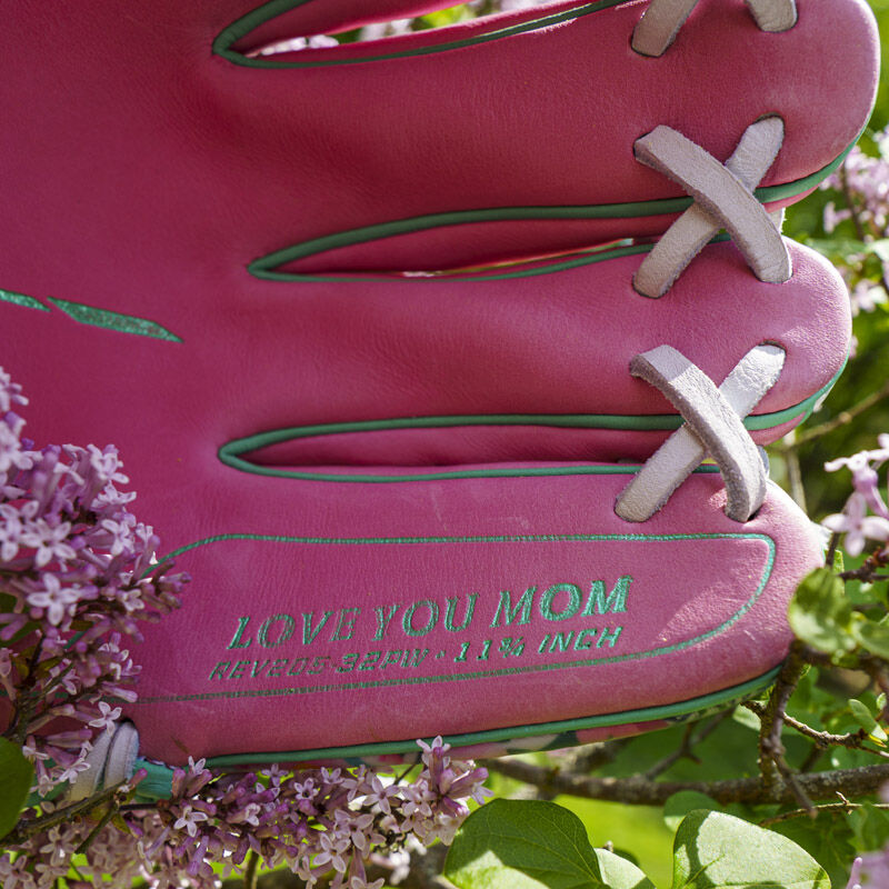 Picture of the pinky stamp that says "Love you Mom" on a Rawlings Race Day REV1X infield glove loading=